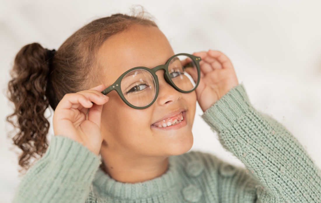 young girl wearing glasses